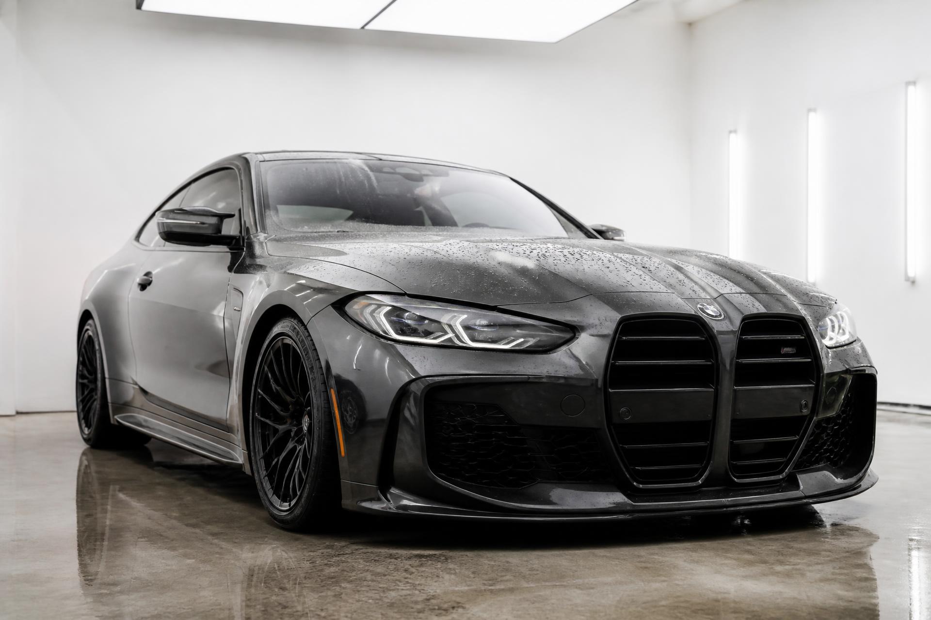 Metallic sports car detailed to a mirror finish inside a bright Cape Town detailing studio
